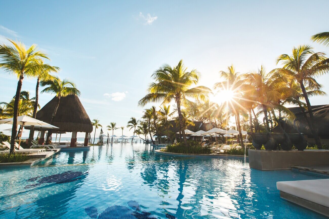 swimming-pool-among-palm-trees-on-a-tropical-islan-2024-08-08-06-13-39-utc.jpg